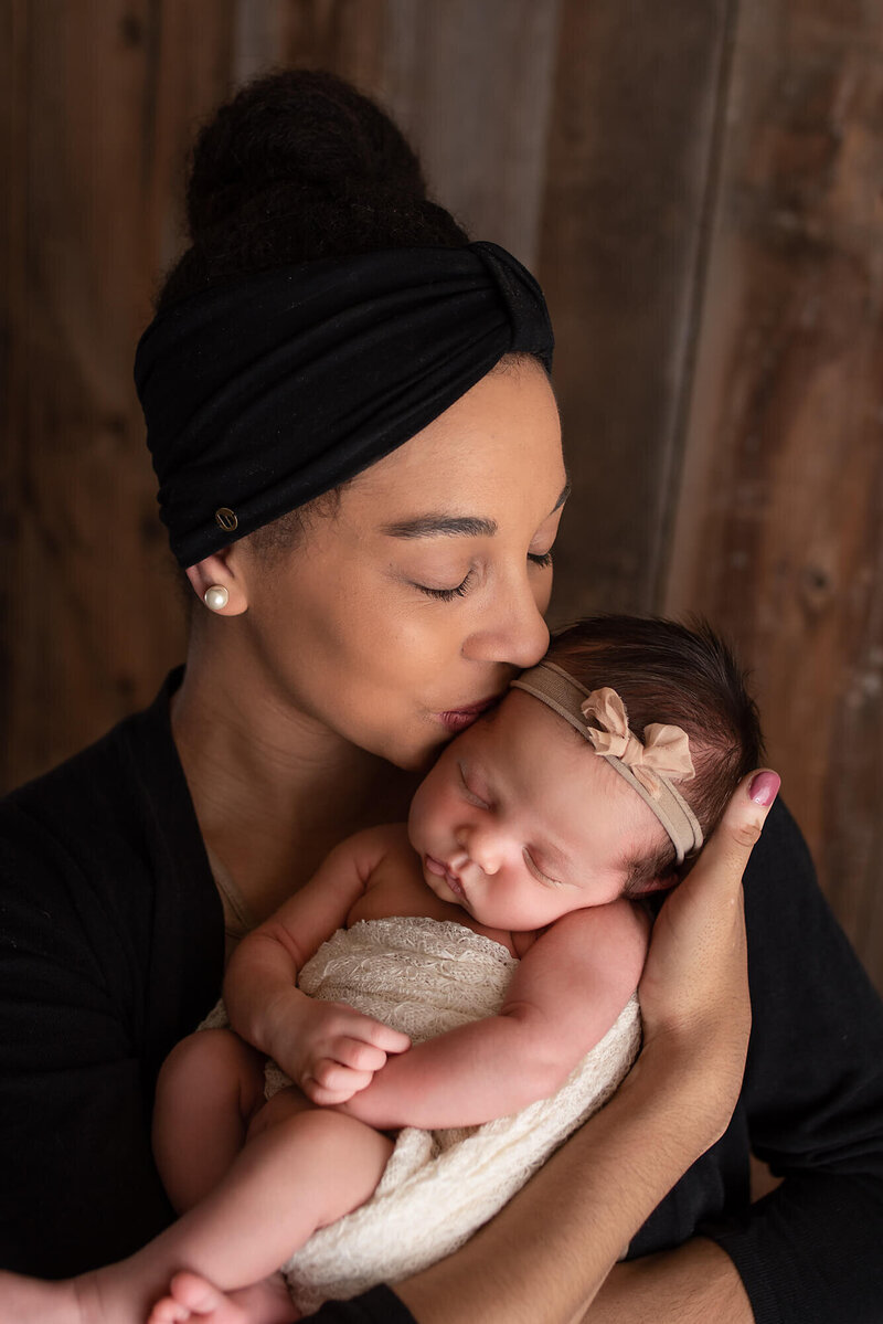 Ripon Wisconsin Newborn Photo in studio with mom kiss | Glory Be Photography by Tara Bos