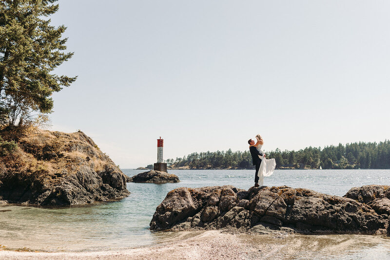 Utah Wedding Photographer captures outdoor wedding with bride and groom standing on a rock