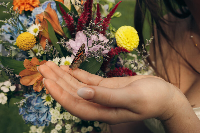 detail wedding shot of couple and flowers