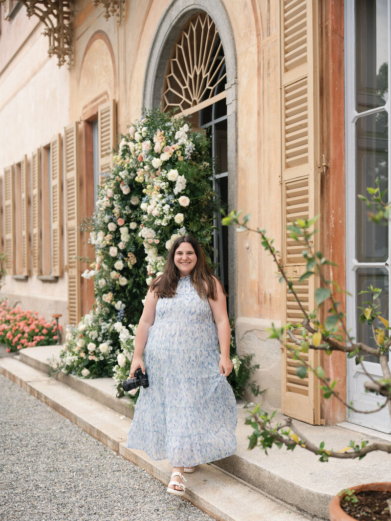 Rachael smiling in a floral dress