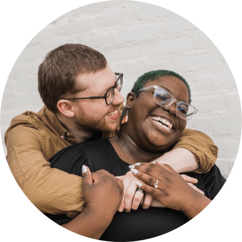 Man and Woman smiling and embracing each during a photo session in philadelphia.