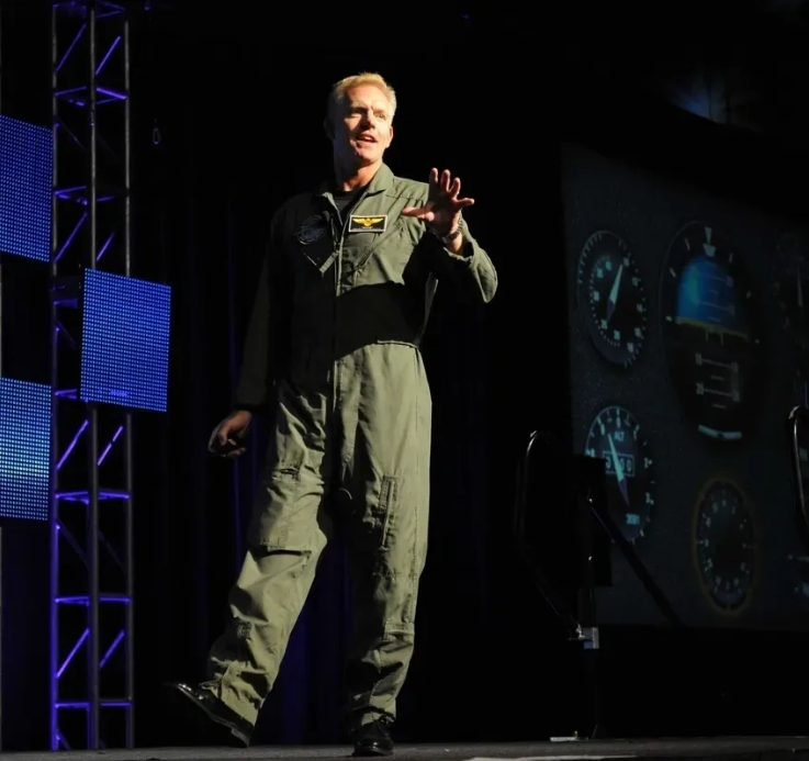 a picture of a former blue angels pilot and keynote speaker who is a student of Lindsay Lovell in her real estate investing course