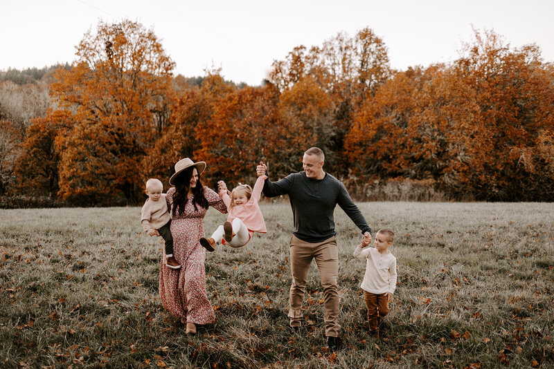 family swinging kid