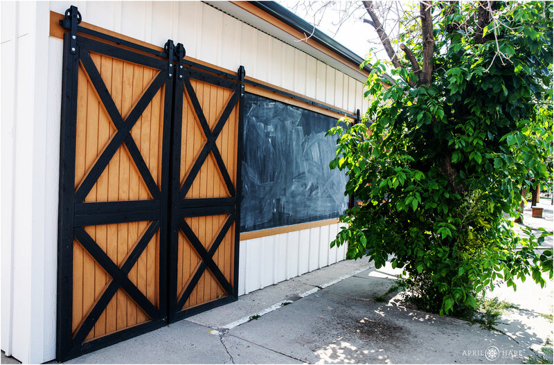 1 Exterior-Sliding-Barn-Door-with-Chalkboard-Wall-at-Hearth-House-in-Monument-CO