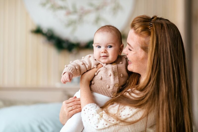 Mother smiling at baby