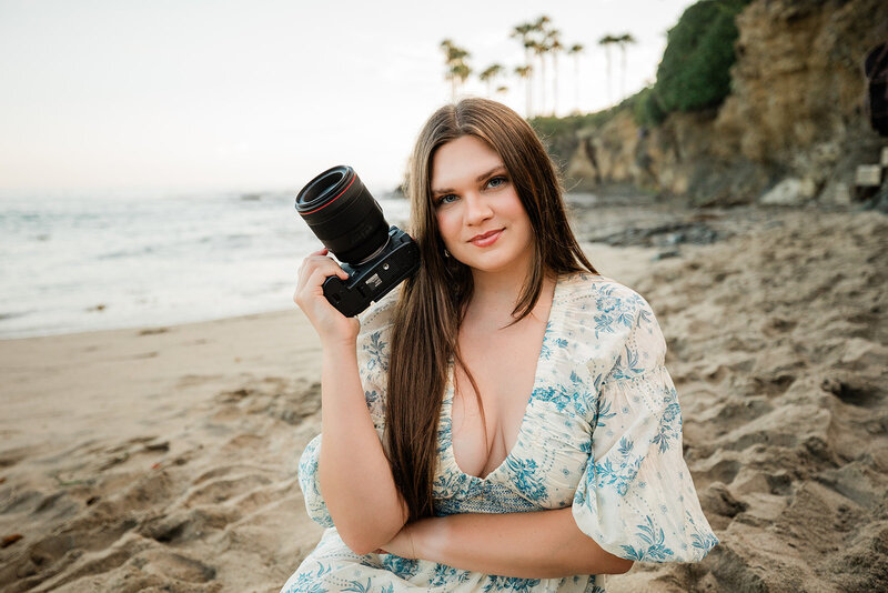 photographer holding camera in business casual wear