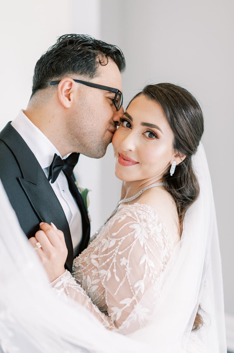 Bride is embracing her husband