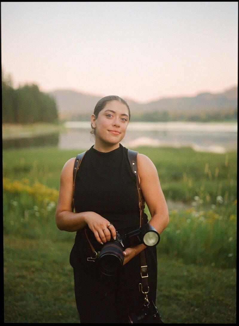 Portrait of Puerto Rico photographer with gear in field setting

