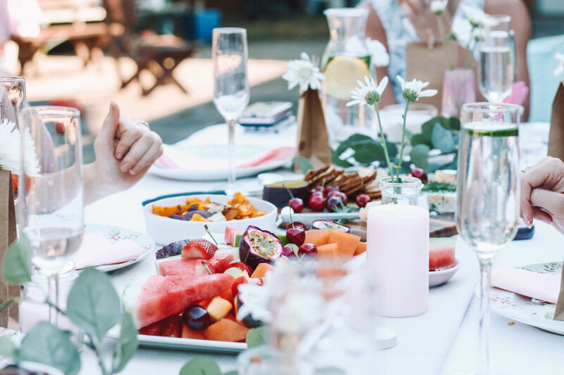 Dining table with utensils, foods, glass with water at a wedding at Celilo Inn