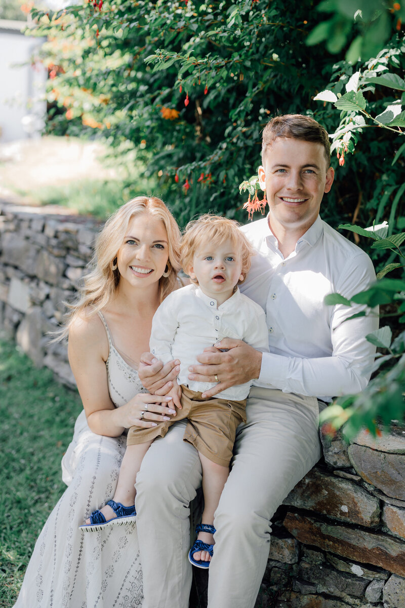 familu-sitting-together-in-their-garden