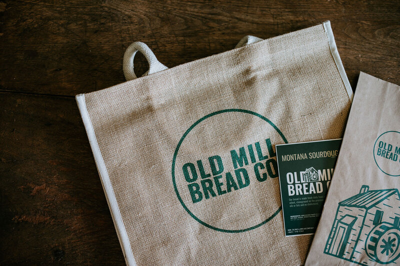 Custom logo on natural canvas tote brand merch created by Liberty Type, a woman-owned Knoxville-based brand agency