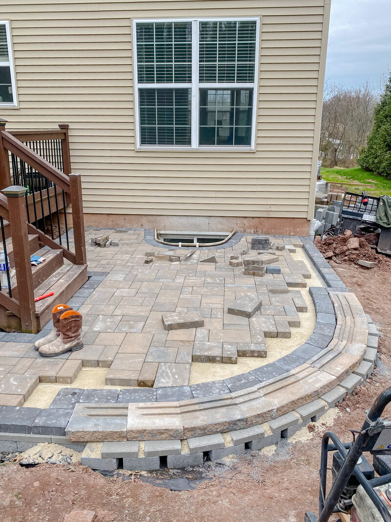 In process shot of a paver patio being installed