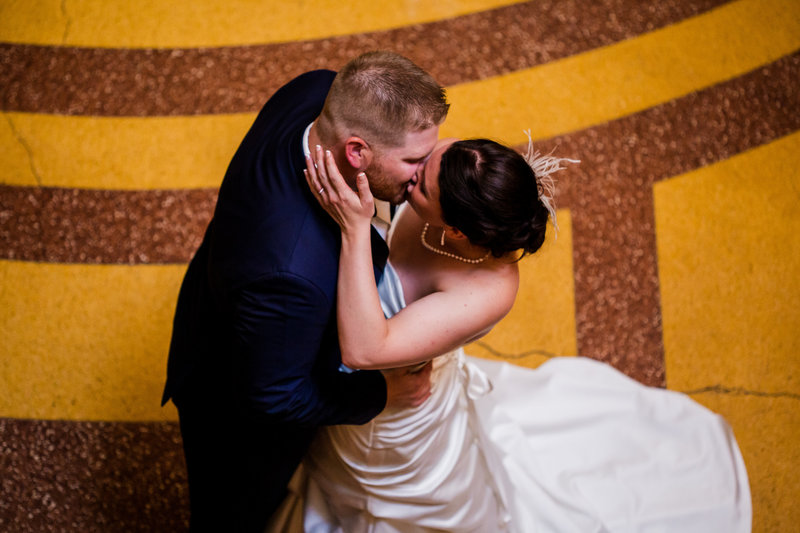Bride and groom's frist kiss as seen from the top of the Grand Staircase at the Warner Theatre