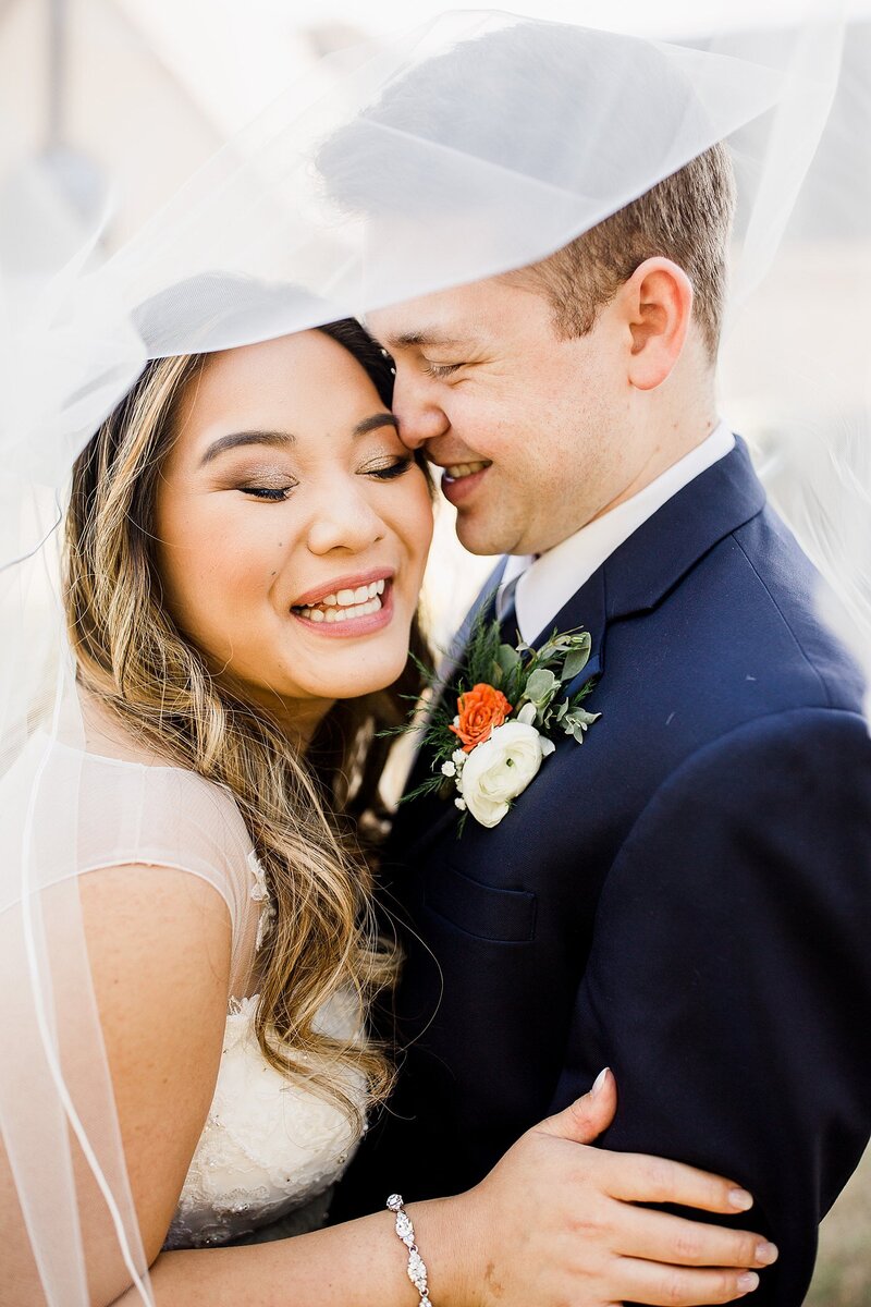 couple under veil by knoxville wedding photographer, amanda may photos