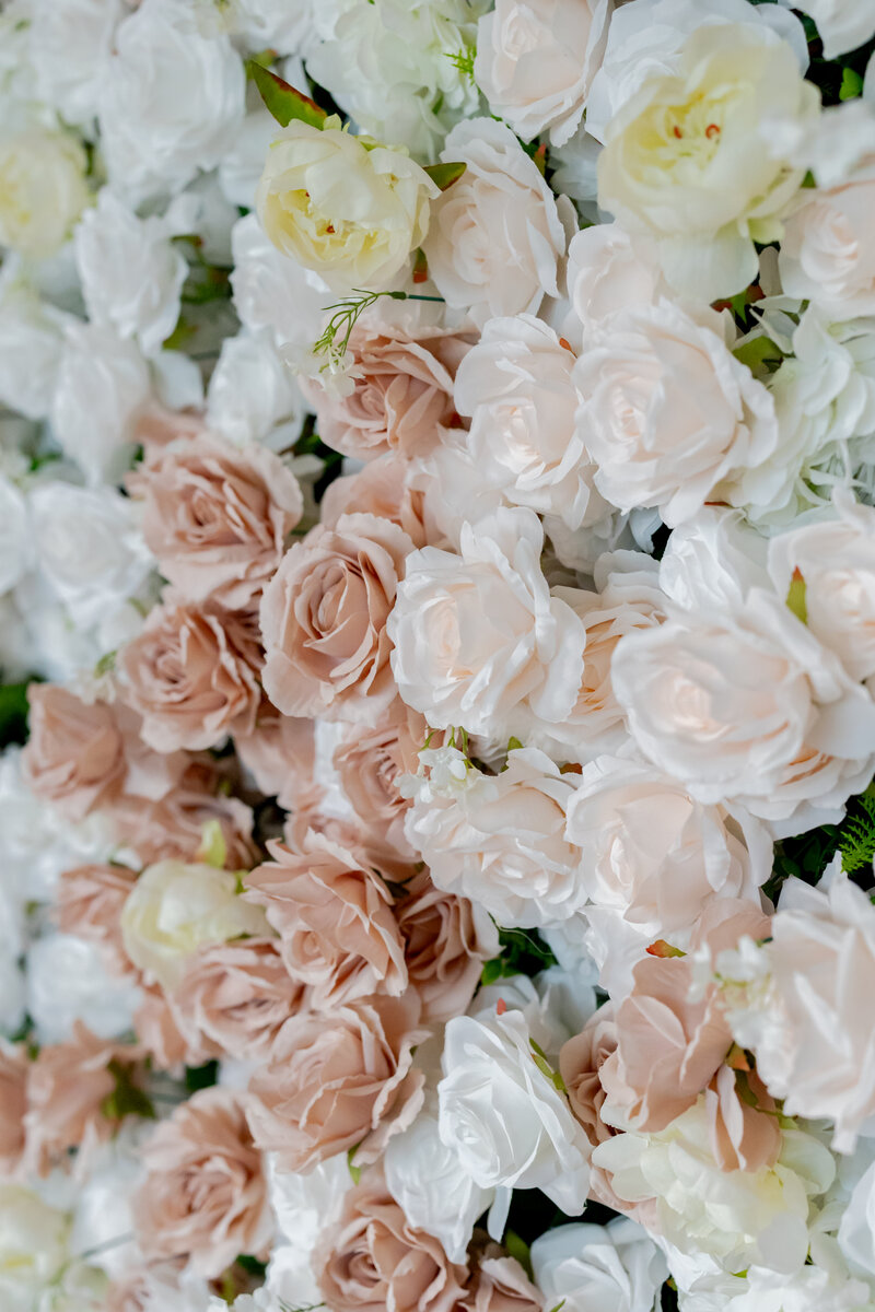 Pink flower wall with white and pink roses.
