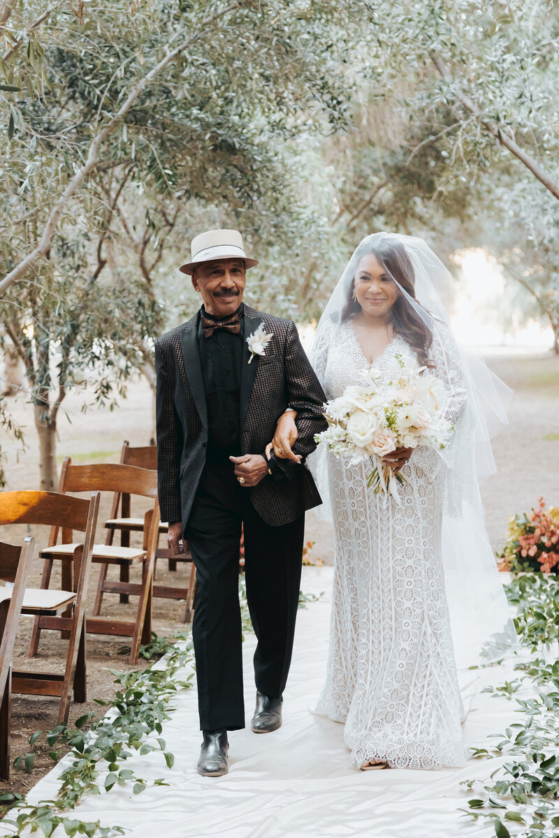 couple walking up aisle