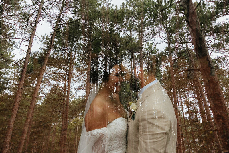 bride and groom double exposure shot with the bride and groom and trees