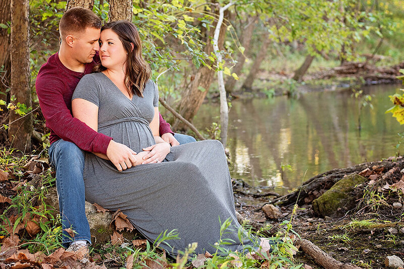 Couple along river in the woods_maternity