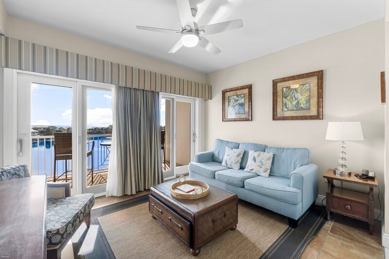 living room with blue couch and coffee table