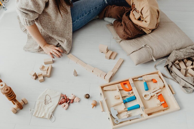 Children interacting in sensory play area with blocks and toys