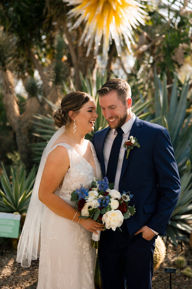 bride-and-groom-with-florals-tropical-plant-background