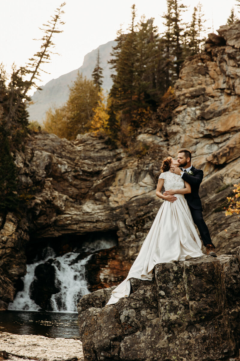 couple standing on cliff side in Montana