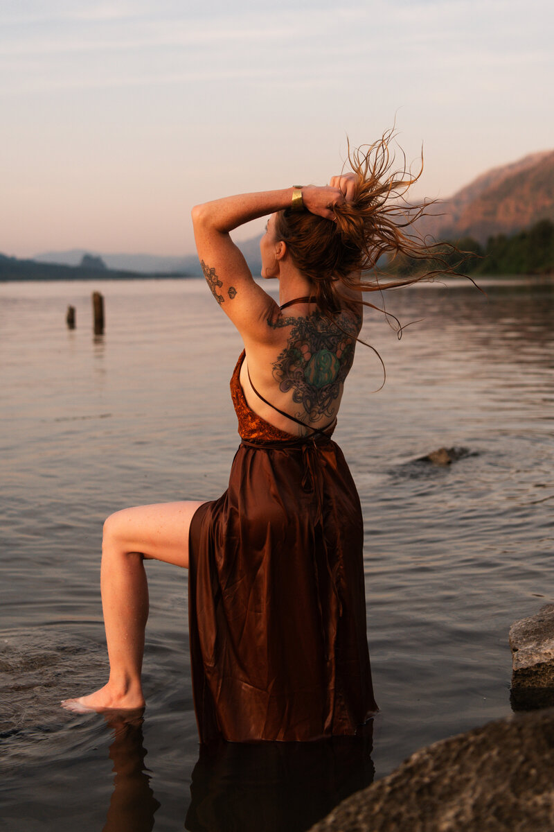 yoga teacher standing in the river