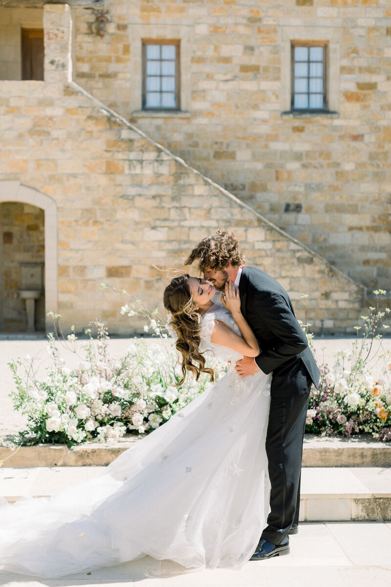 bride-and-groom-sharing-intimate-kiss