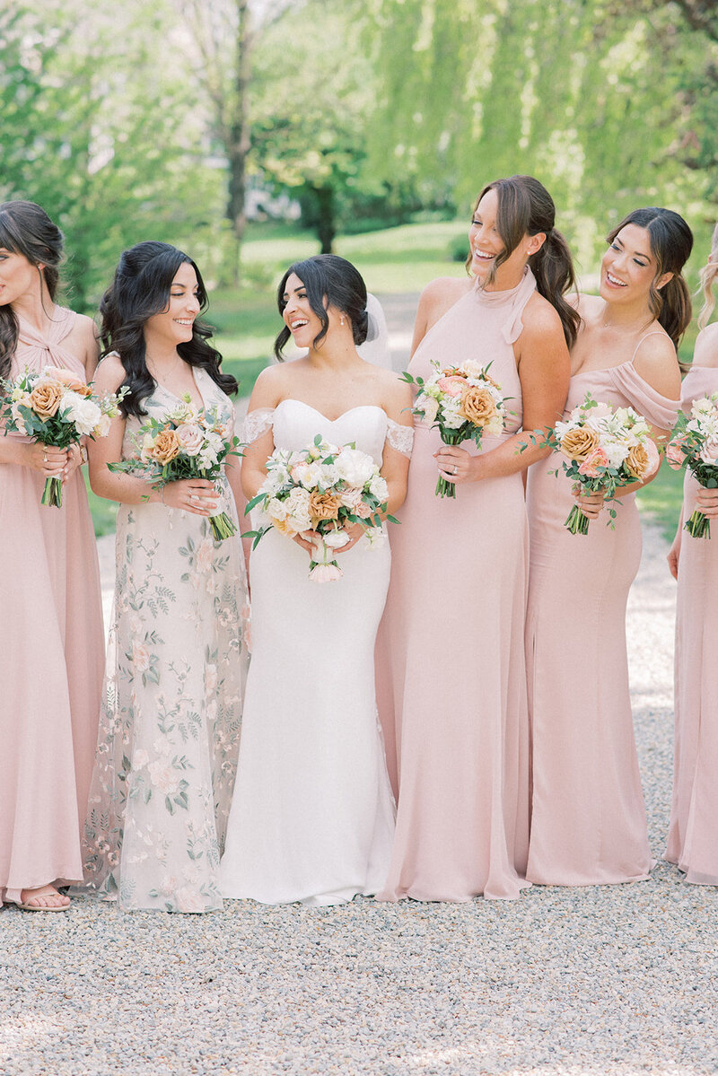 A few joyful moments among the bride and bridesmaids at the lane at Crossed Keys Estate captured by NJ Wedding Photographers | Michelle Behre Photography