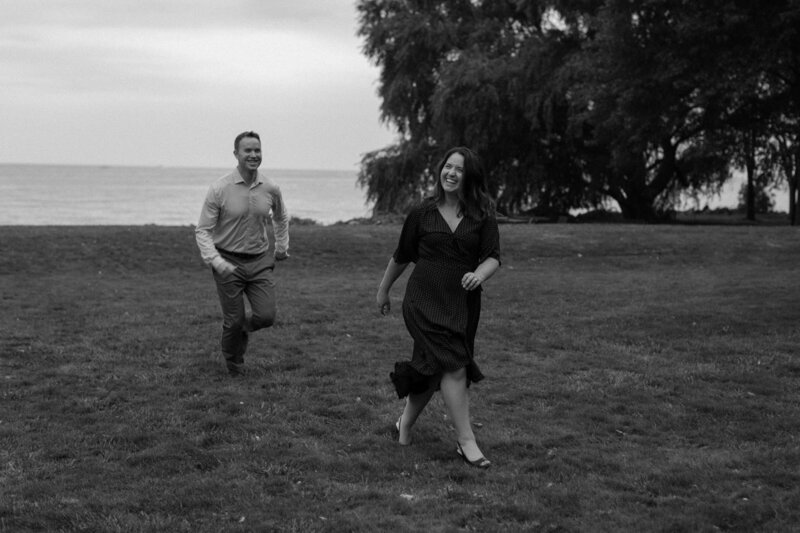 A person running behind their partner in a field 