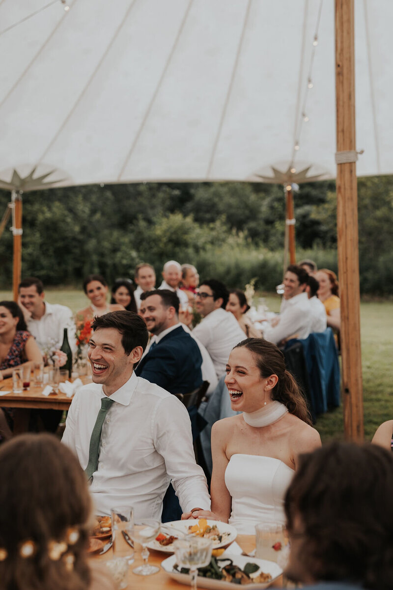 New England couple holding hands laughing together