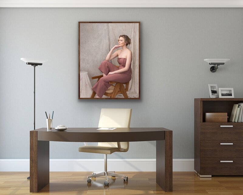 Study room with a framed female branding portrait on the wall