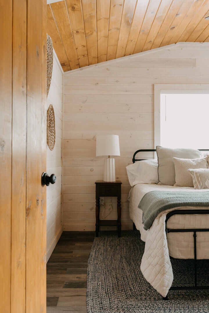 Master bedroom with iron farmhouse bed frame