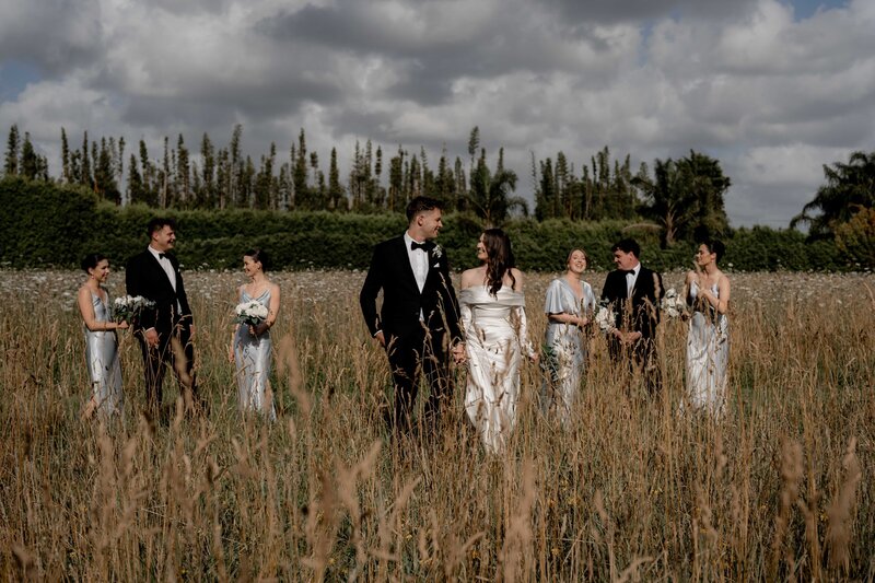 outdoor wedding photography of bridal party at markovina vineyard estate in new zealand