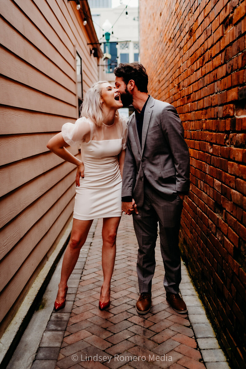 romantic elopement pose down alleyway in downtown Lafayette, louisiana