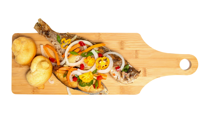 Escoveitch fish on a wooden chopping board, with peppers, and festivals.