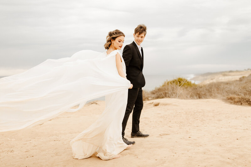 bride and groom at cliffside elopement in Santa Monica
