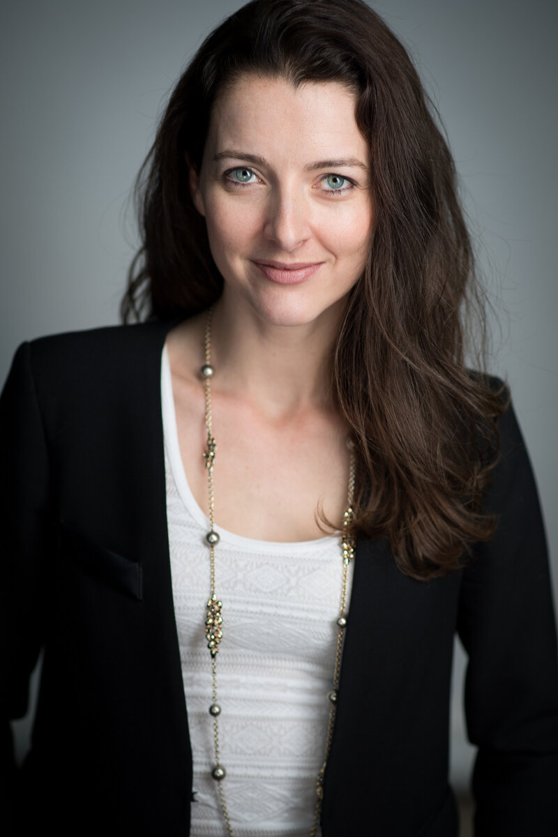 Molly Curry in black blazer, professional coaching and strategic leadership guidance.