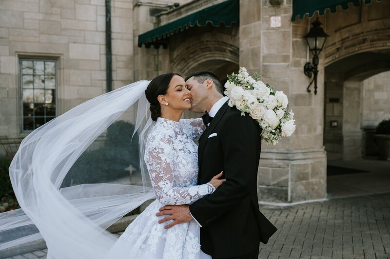 Groom kissing bride's cheek