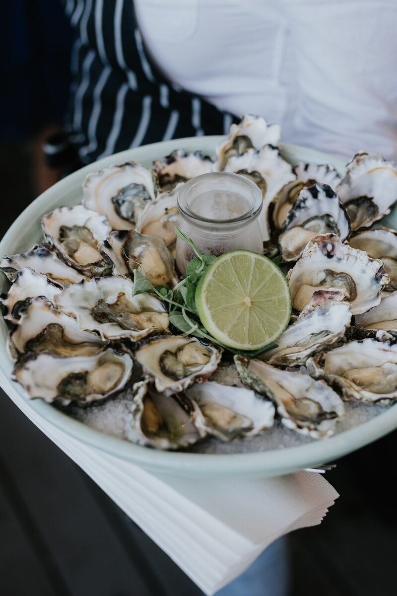 There are many wonderful dining experiences on the NSW Central Coast. Check some of them out here. The image shows a plate of oysters, which are grown locally in Broken Bay.