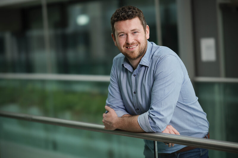 Eoin, director at Fluent Accounting Ltd., standing on glass bridge