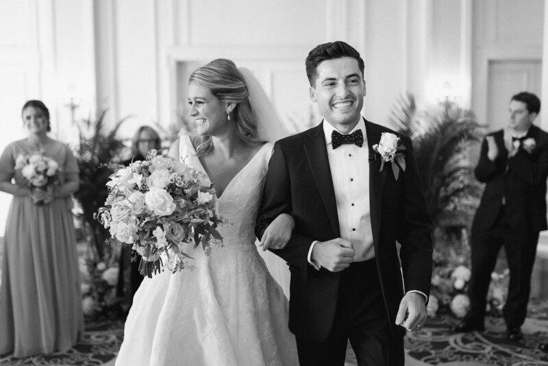 couple walking out from their ceremony at the Jefferson Hotel in Richmond