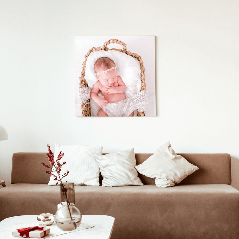 Newborn photo of baby girl on the wall