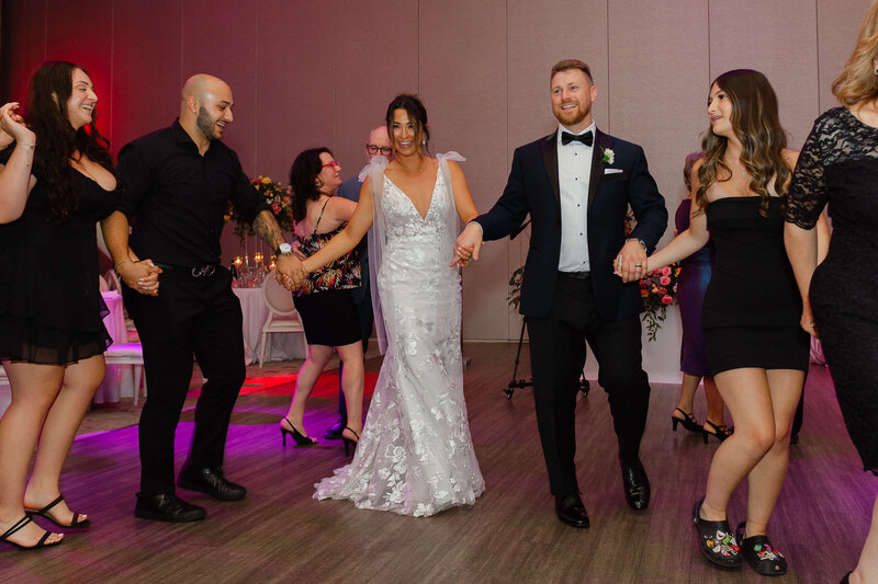 Ottawa wedding photography of a bride and groom dancing with their guests during their Chateau Le Parc wedding reception