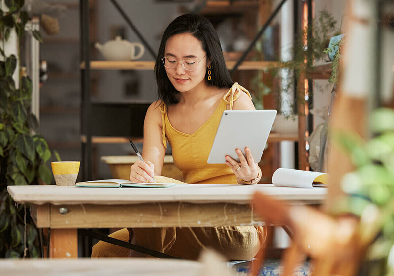 female creative entrepreneur working on ipad