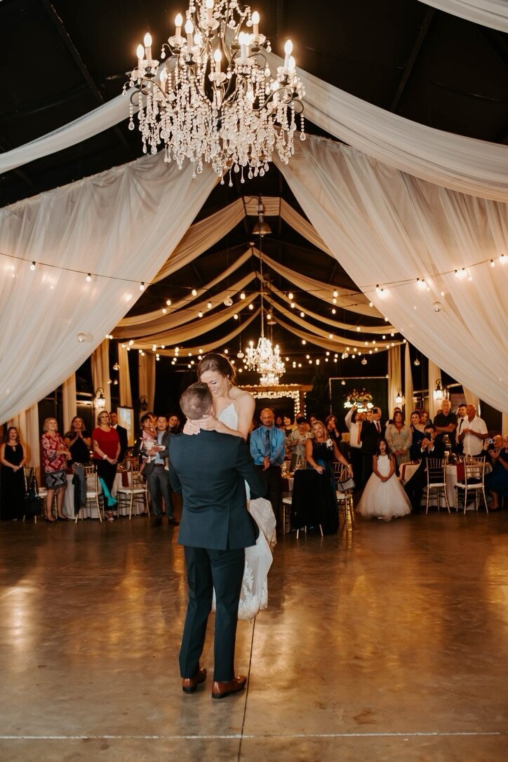 Groom carrying bride in their wedding dance