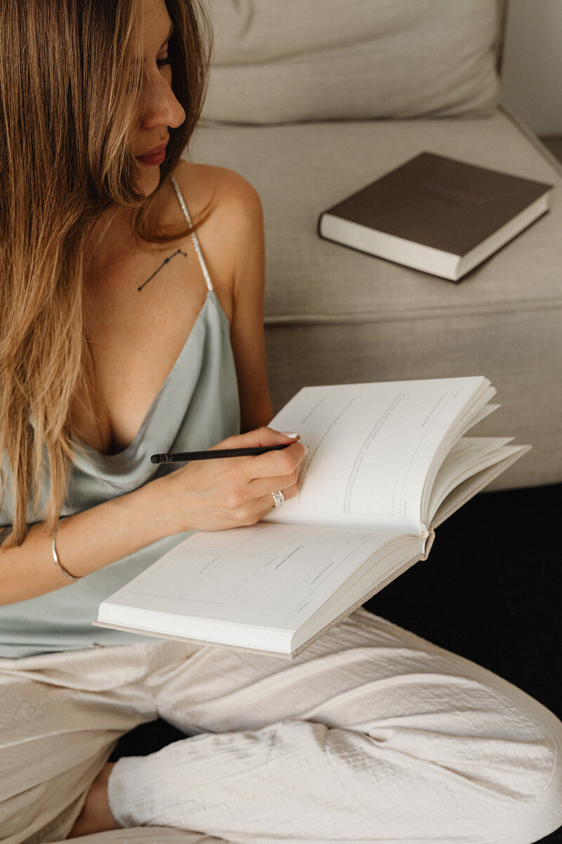 A financially empowered woman in control of her financial health reviewing her finances with confidence.
