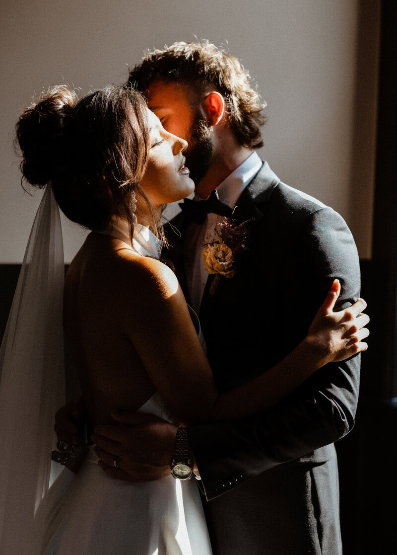 Bride under a translucent veil with soft natural lighting