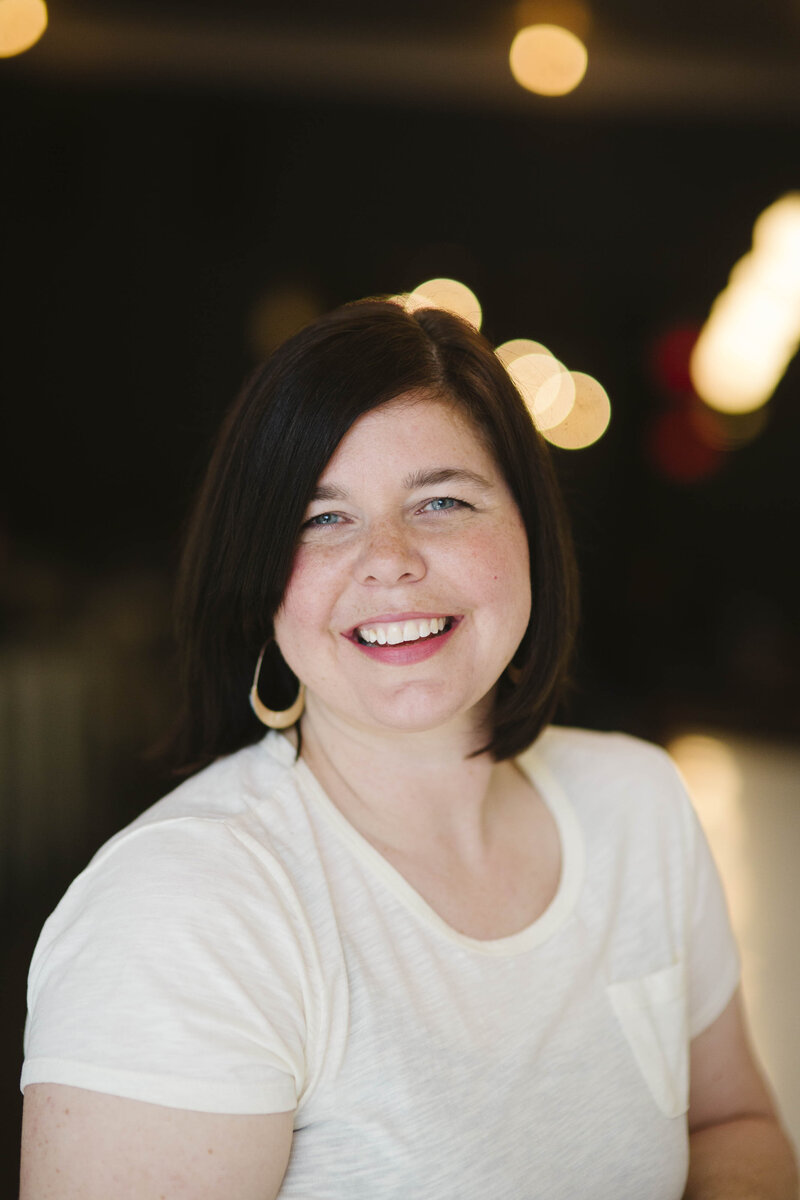 Headshot photo of Sarah Williams in a cafe in Edmond