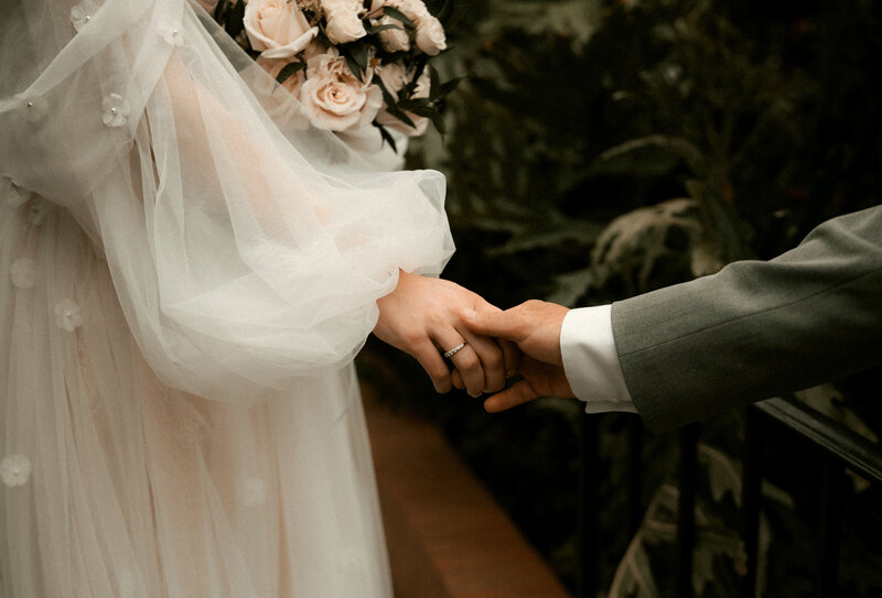 Bride Holding Groom Hand at Phipps Conservatory Wedding